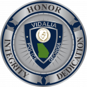 Vidalia Police Department seal with patch and core values of honor, integrity, and dedication.